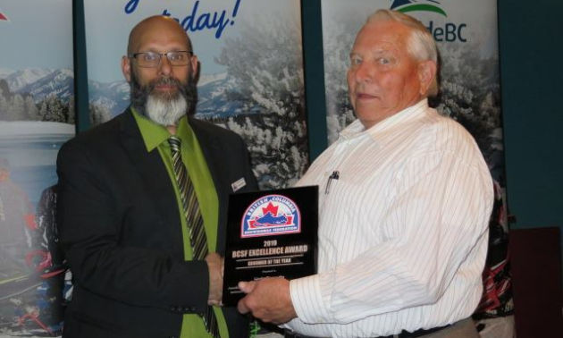 Herb Shaede accepts the British Columbia Snowmobile Federation award for Groomer of the Year.