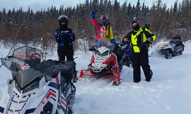 A few snowmobilers stop for a break in Hudson Bay, Saskatchewan.