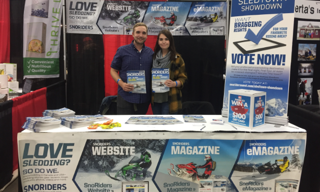 (L to R) Jason Woods, advertising consultant for SnoRiders magazine, and Samantha Ranger represented SnoRiders at our booth at the Alberta Snowmobile and Powersports Show in Edmonton, Alberta. 