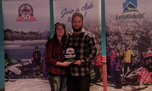 Drew and Liane Leger pose with their Outstanding Snowmobile Family award at the 2019 British Columbia Snowmobile Federation Excellence Awards.