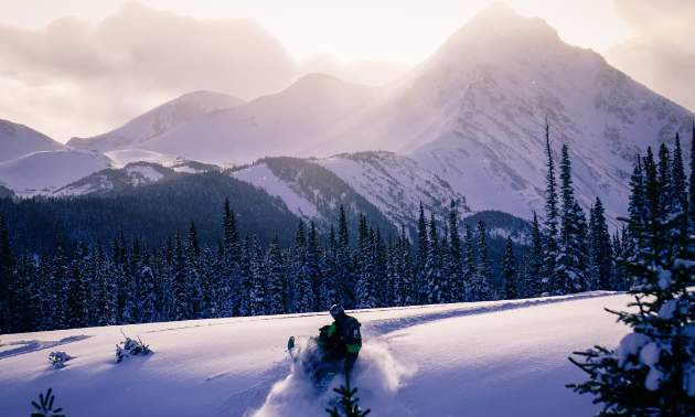 A snowmobiler enjoys riding in the Kakwa region of the North Rockies.