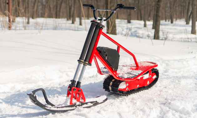 A red electric snow scooter.