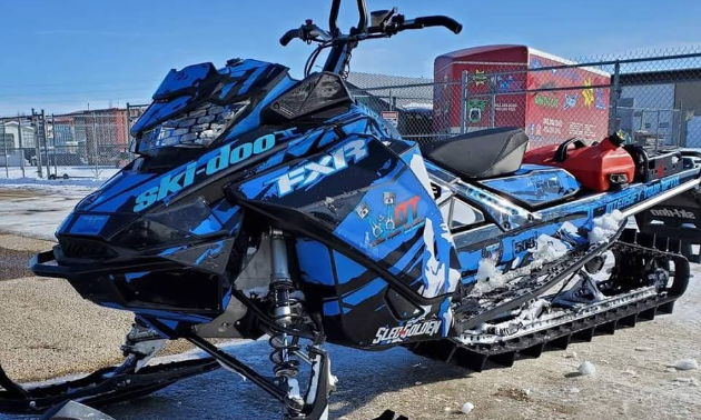 A blue and black 2019 Ski-Doo Summit 850 165 snowmobile.