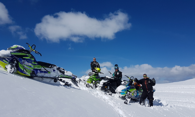 (L to R) Curtis Anderson, Marshall Dempster and Danny Roberts, photographer for Boosted Imagery, take a moment to chill on their eventful day sledding in the backcountry.