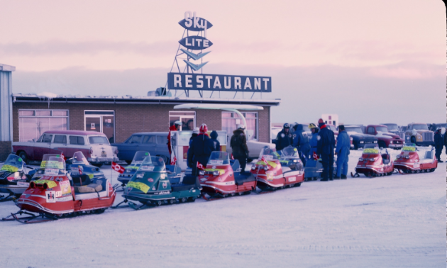 Snowmobile riders line up for the Manitoba Centennial