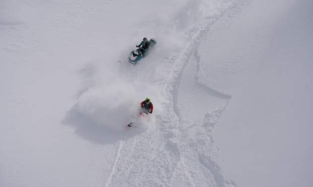 This bird’s-eye view shows off Curtis Pawliuk (red) and Marshall Dempster (teal) cutting through fresh powder.