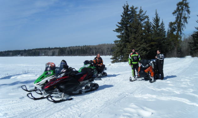 A group of riders takes a rest on the east side of Cold Lake.
