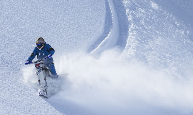 Cory Derpak sidehilling on the Yeti snow bike in Alaska. 