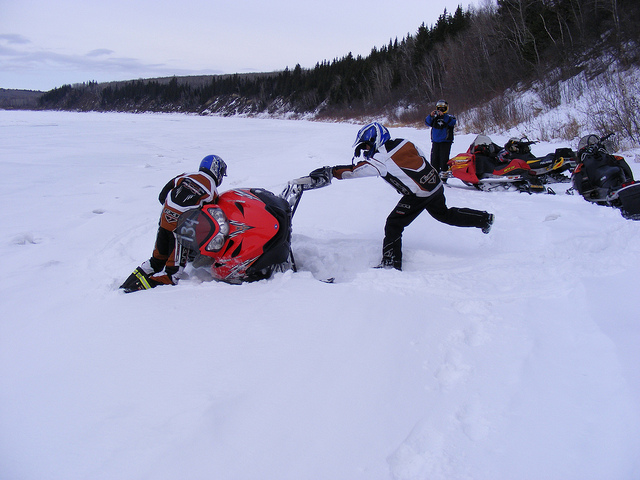 A sled tipped over on the Saskatchewan River. 