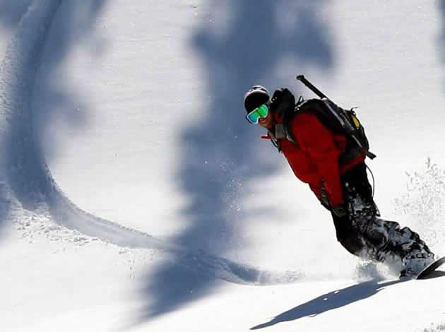 Albert Venor, president of Blue River, Powder Packers, snowboards in Blue River, B.C.