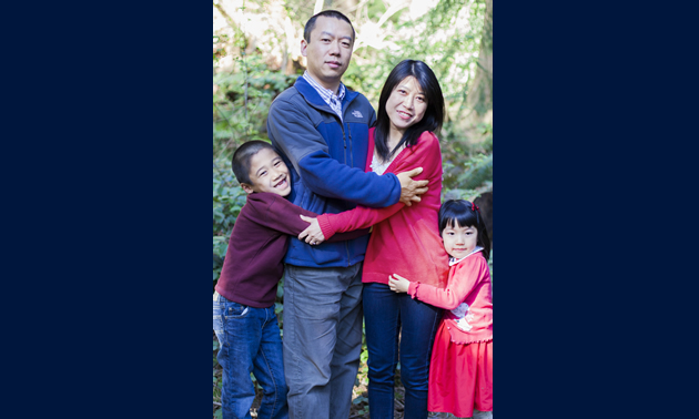 Andrew Ji with his parents Tony and Kelly.