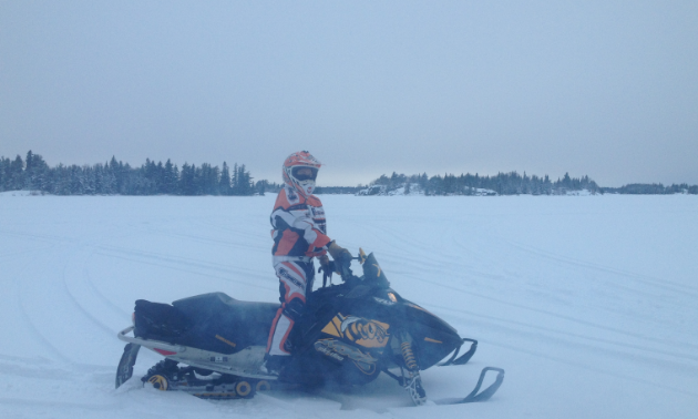 Ashley Erickson snowmobiling on Whiteshell's trails 