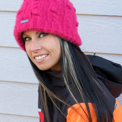 Ashley Chaffin with a big smile and a red hat