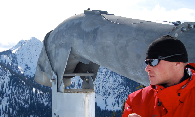 Robb Andersen is responsible for policy, procedure, and assisting with capital projects and improvements with the avalanche risk management infrastructure. Here he is standing beside a Gazex exploder.