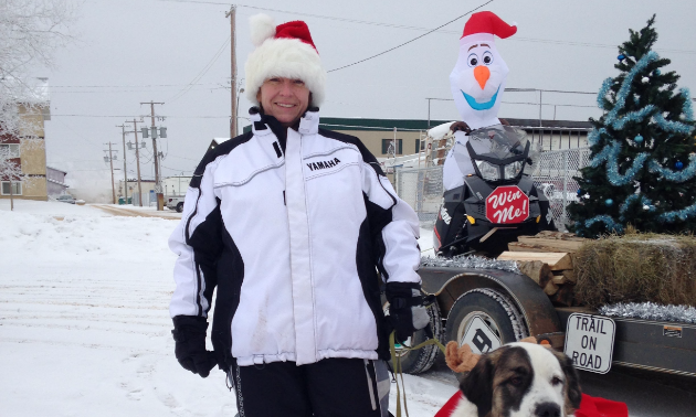 Brenda and her reindog, Patches, get ready to hand out candy at the Santa Claus Parade.