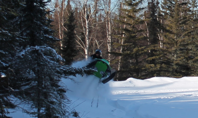 Brenda’s friend Danny jumps the stump in High Level.