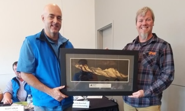Chris Brookes from the Alberta Snowmobile Association accepts the annual service award from Avalanche Canada. The award was presented during the Alberta Snowmobile Association's annual general meeting.