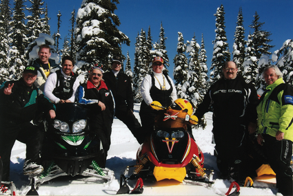 Kathy and Dale Eliuk pose for a photo with their friends at Lumberton, a popular riding area near Cranbrook, B.C.