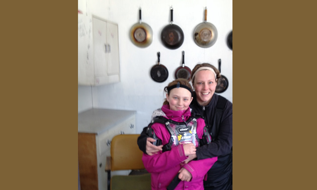 Erik Foster's daughter, Makenna, and his wife, Heather, enjoying the Saskatoon Snowmobile Club's warm up shelter.