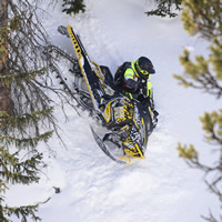Bret Rasmussen in action on his snowmobile 