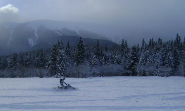 Rad Rider, Peter Schlief enjoying the mountain backdrop.