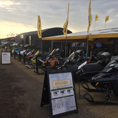 Picture at Hay Days, showing row of snowmobiles. 