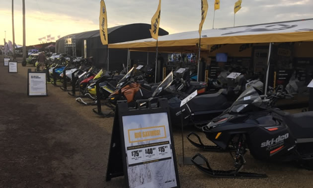 Picture at Hay Days, showing row of snowmobiles. 