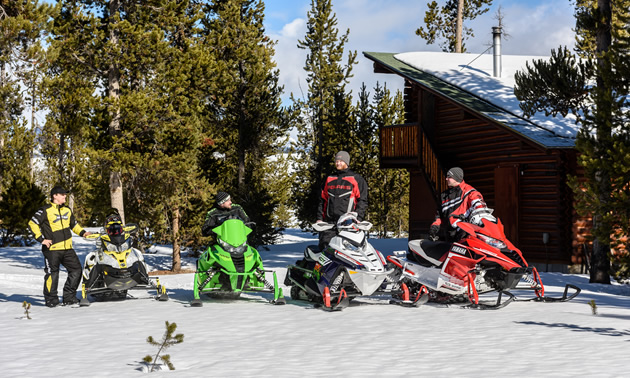 Group of people going out snowmobiling. 
