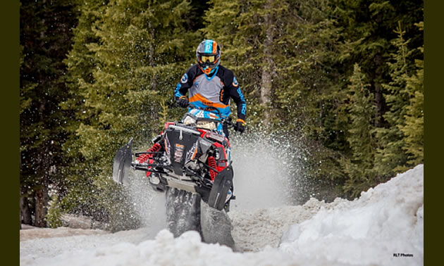 Photo Keith Curtis riding snowmobile