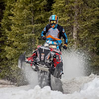 Photo Keith Curtis riding snowmobile