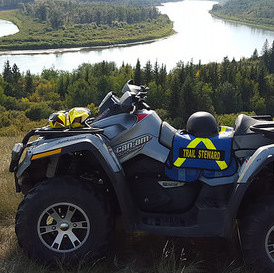 An ATV sitting up on a bank that overlooks the North Saskatchewan River, near Lindbergh. 