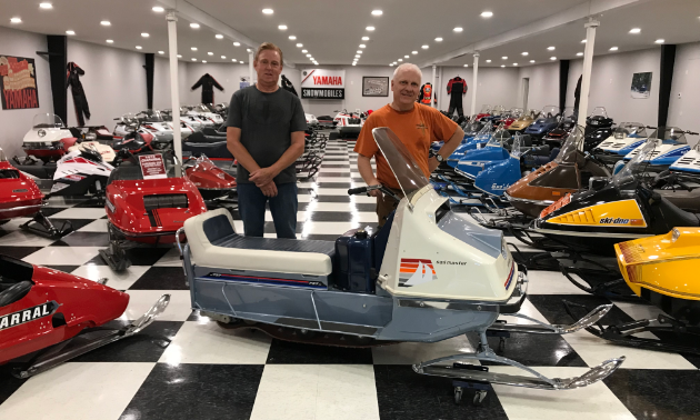 (L to R) Lorne Larson and Valdy Stephonson, president of the America Vintage Snowmobile Association, pose with a 1966 prototype Evinrude Sail Master. 