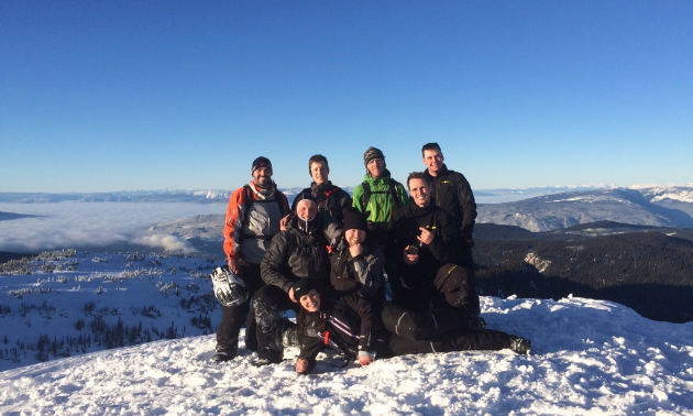 Schlief and his sledding friends pose out in the mountains near Grande Prairie, Alberta.