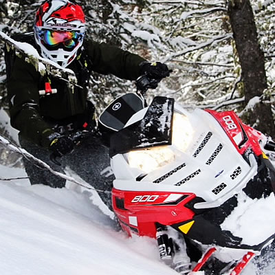 A snowmobiler out in the backcountry. 