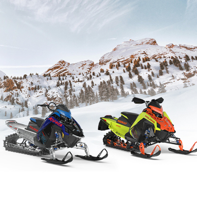 Two sleds sitting in snow