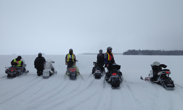 A group of Journey for Sight riders crossing Setting Lake near Wabowden. 