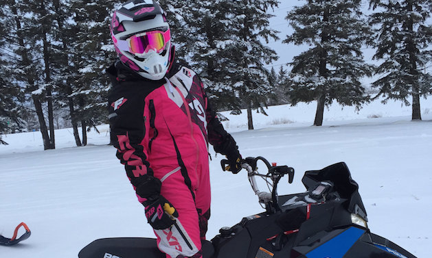 Sasha Bodie is ready to rip on her 2016 Polaris SKS 800 155 decked out in FXR Racing gear. 