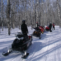 A group of sledders on a trail in Saskatchewan. 