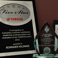 Three awards for service, naming Schrader Holdings and Schrader Motors