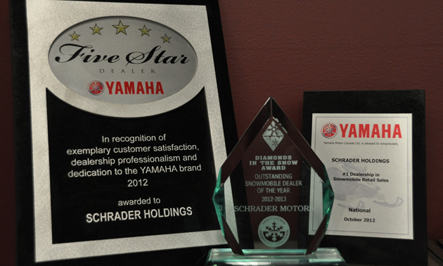 Three awards for service, naming Schrader Holdings and Schrader Motors