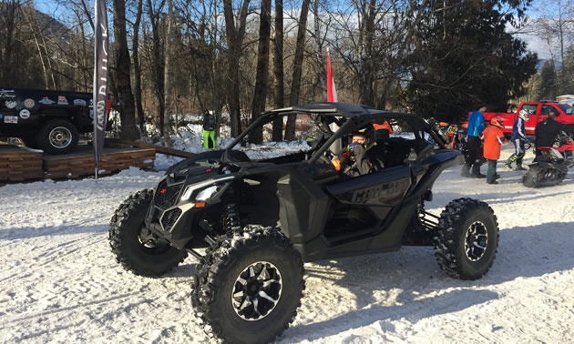 Black ATV on snow racing track