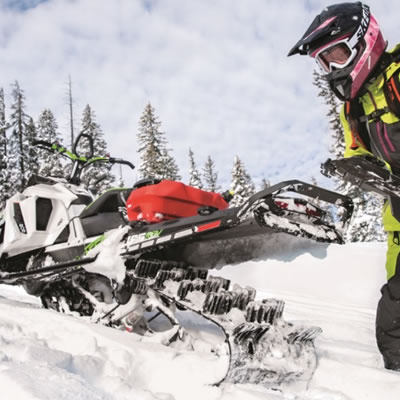 Removable snowflap mounted on snowmobile. 