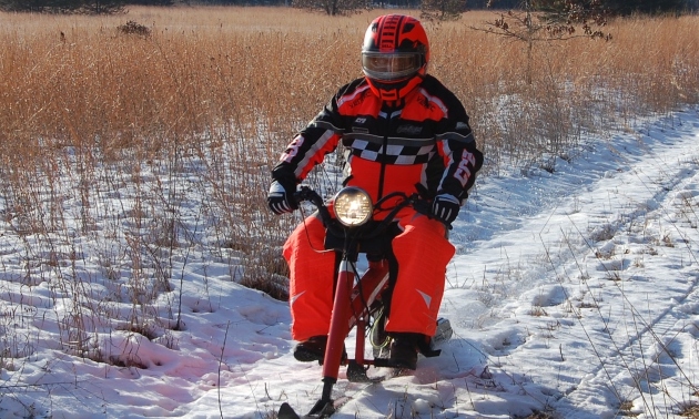 Gary on a Sno-Runner sled he restored