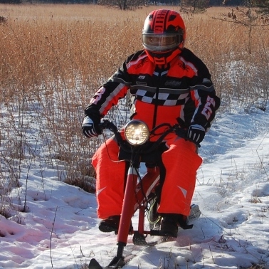 Gary on a Sno-Runner sled he restored