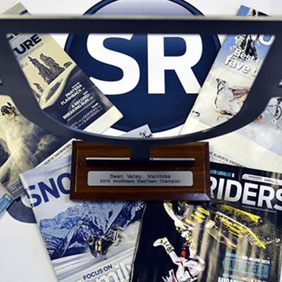 A photo collage of SnoRiders items, including the SnoRiders magazine, the SnoRiders SledTown trophy and SnoRiders logo. 