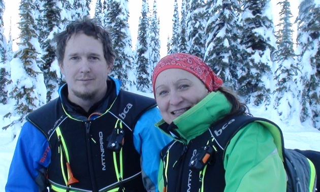 A man and a woman in the backcountry. 