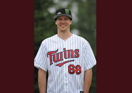 Snowmobile snocross racer Tucker Hibbert will throw the honorary first pitch at a Minnesota Twins baseball game on September 12.