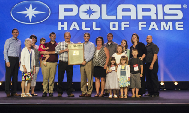 From left to right: back row - Tim Larson, SVP Global Customer Excellence;  Jean Lahmon; Andrea Staats; Emmy Lou Staats; Nathan Staats; Paul Staats; Scott Wine, Chairman and CEO; Mary Lou Staats; Doug Staats; Alayna Wittel; Lindsey Staats; Ashley Wittel and Kevin Wittel. Front Row – (three little ones) Taylor Staats; Tessa Wittel and Carter Wittel.