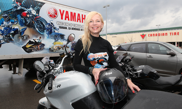 Vicki Gray sitting on her bike