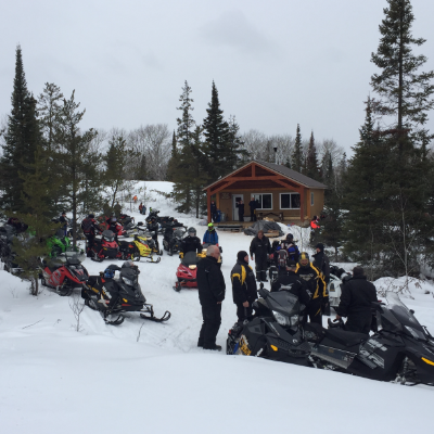 Members of the Whiteshell Snowmobile Club gather for the grand opening of the Swamp Lake warm-up shelter.